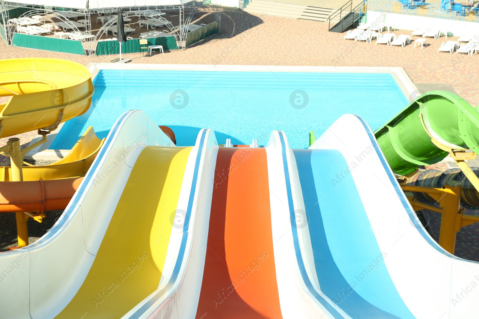 Photo of View from colorful slide in water park on sunny day