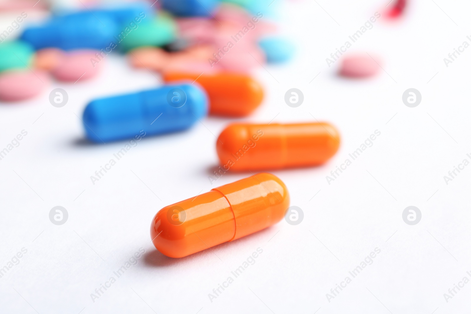 Photo of Different pills on white background