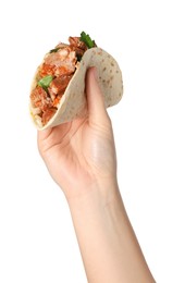 Photo of Woman holding delicious taco with meat and parsley on white background, closeup