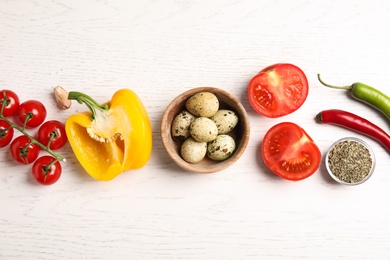 Flat lay composition with ingredients for cooking on white wooden table