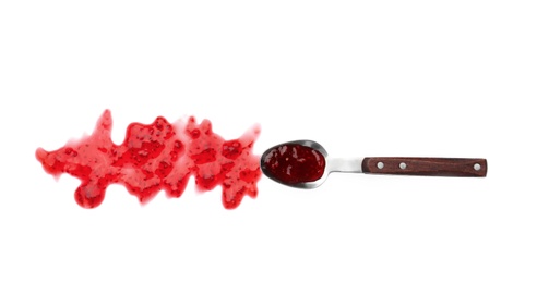 Photo of Spoon and sweet raspberry jam on white background