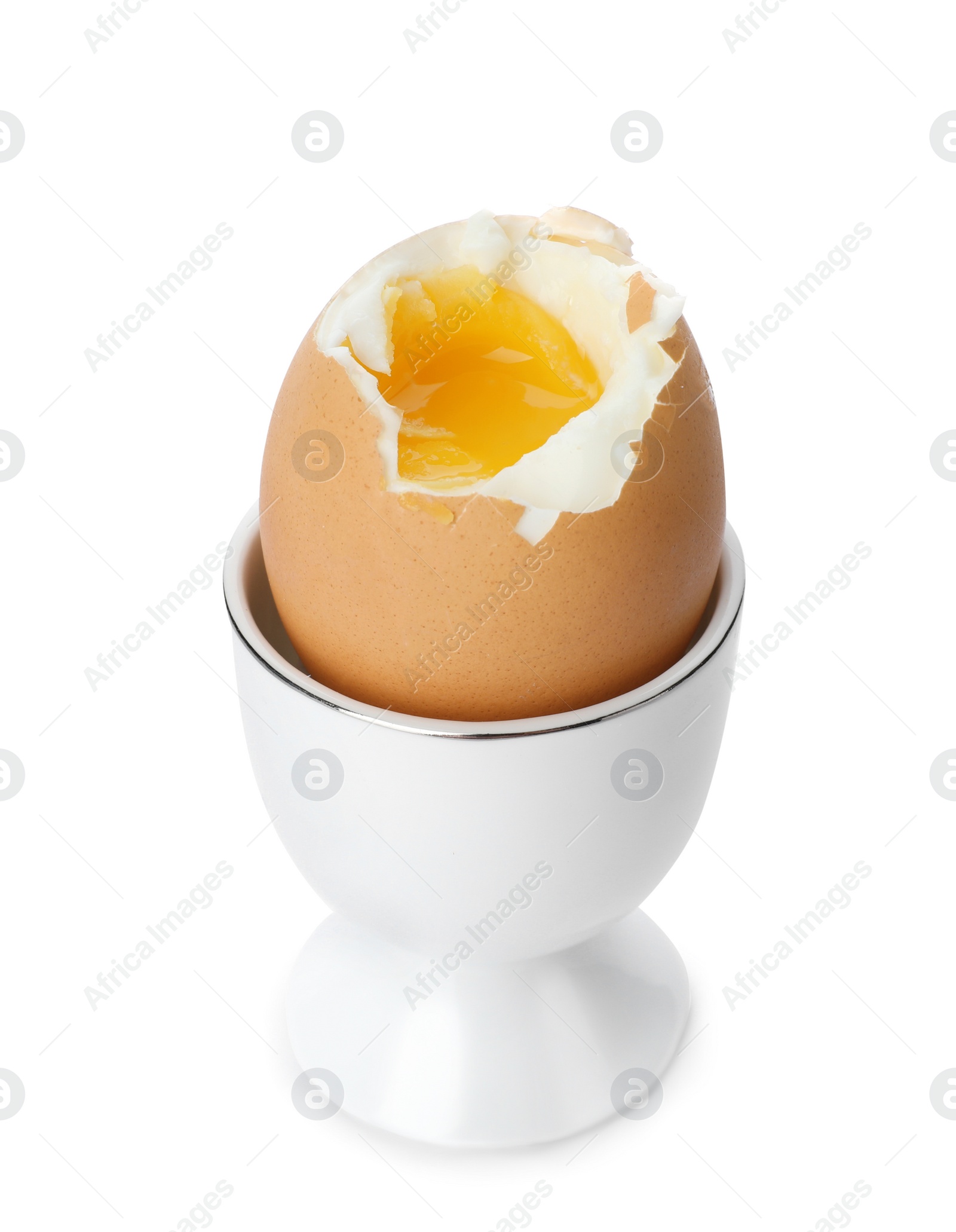 Photo of Holder with soft boiled egg on white background