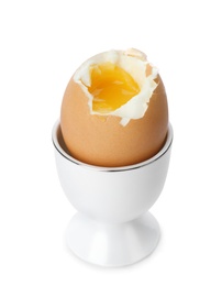 Photo of Holder with soft boiled egg on white background