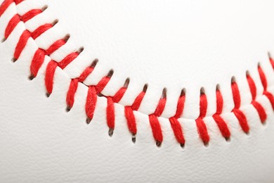 Baseball ball with stitches as background, closeup