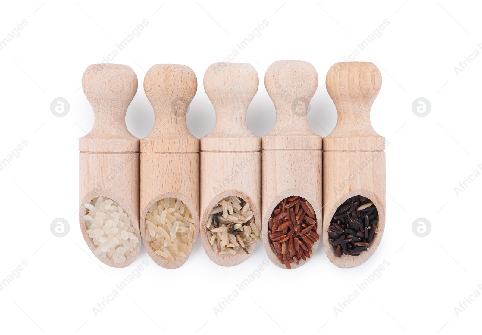 Photo of Different sorts of rice in scoops isolated on white, top view