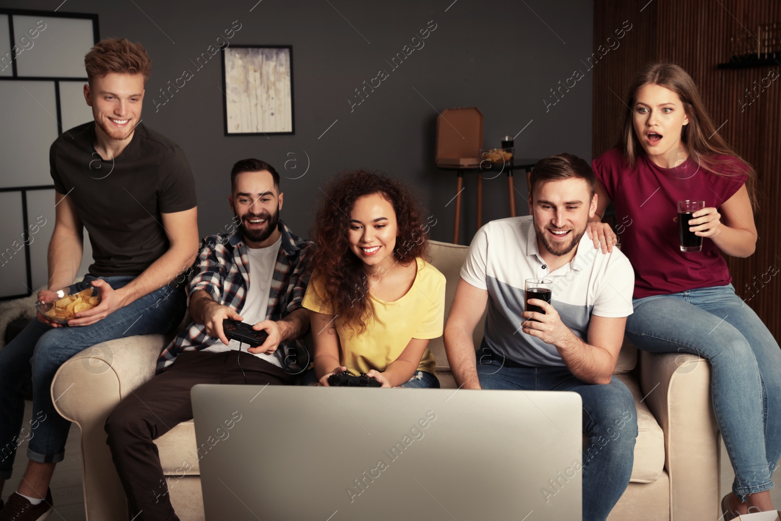 Photo of Emotional friends playing video games at home