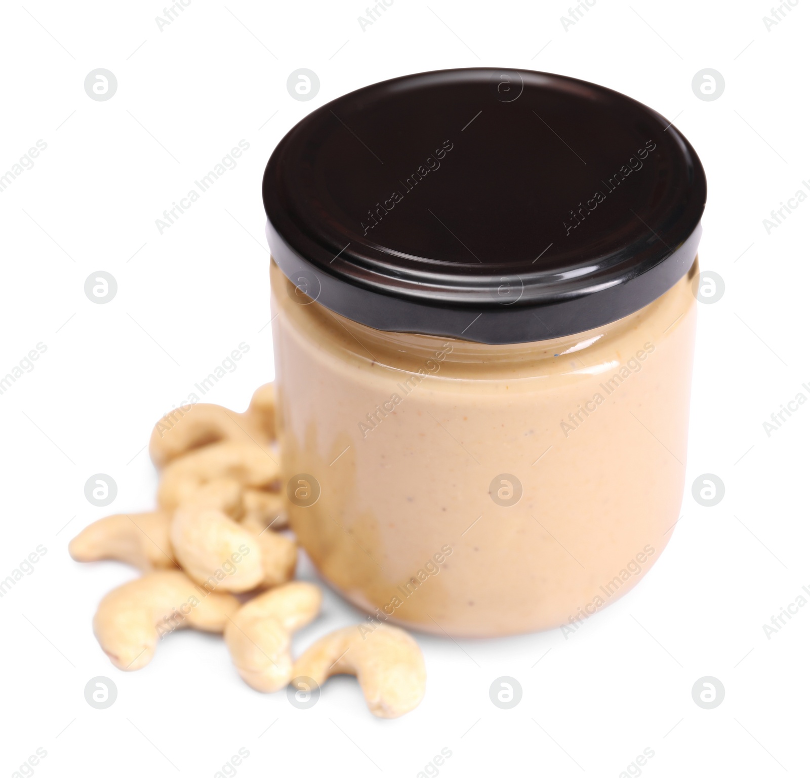 Photo of Tasty nut paste in jar and cashews isolated on white