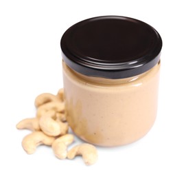 Photo of Tasty nut paste in jar and cashews isolated on white