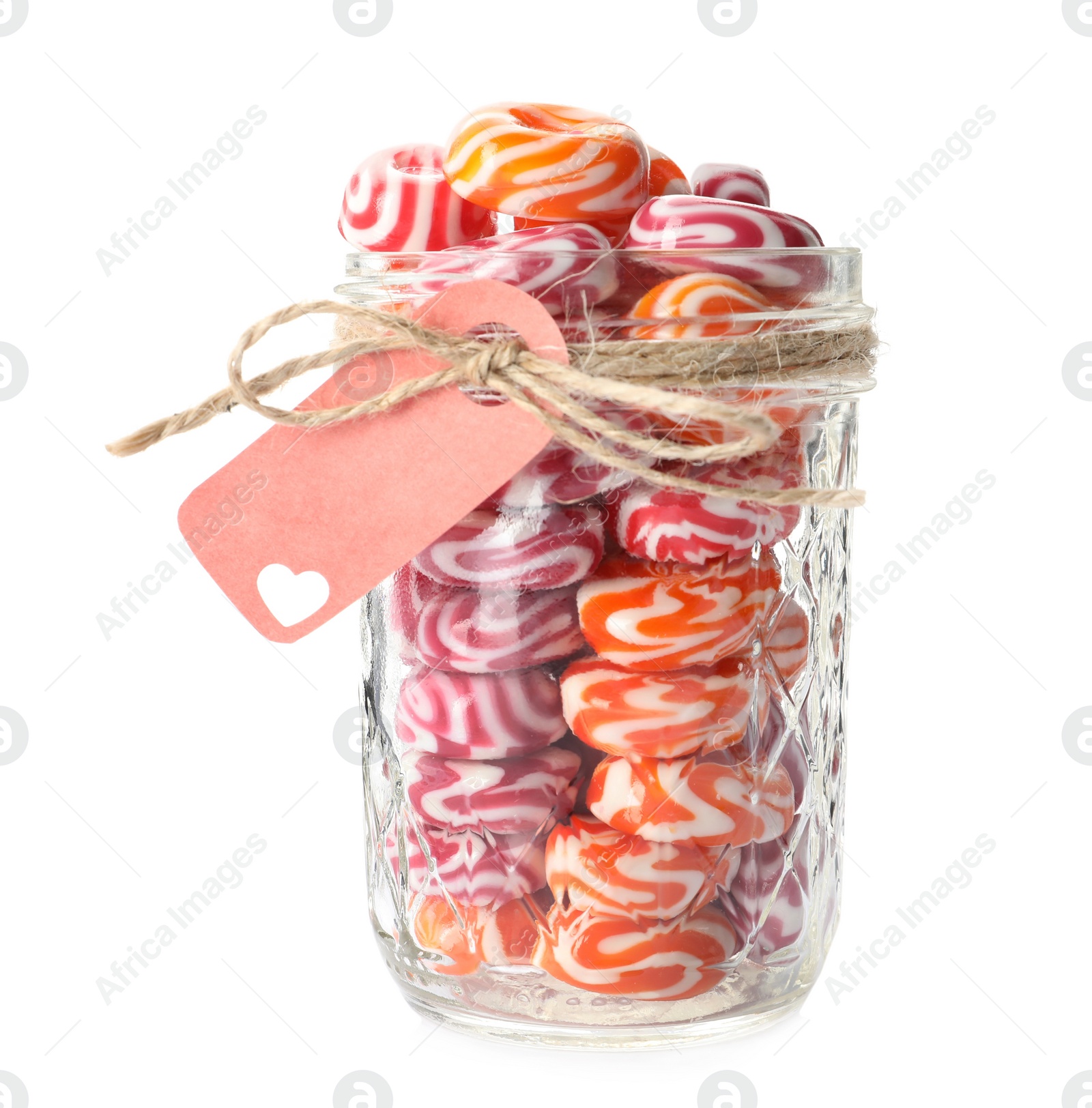 Photo of Hard candies in glass jar isolated on white