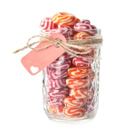 Hard candies in glass jar isolated on white
