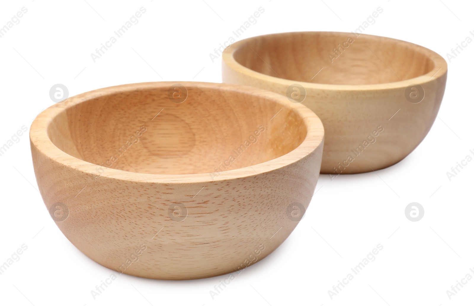 Photo of Two new wooden bowls on white background