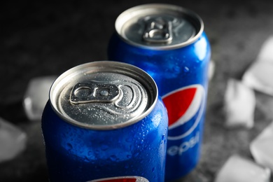 Photo of MYKOLAIV, UKRAINE - FEBRUARY 11, 2021: Cans of Pepsi with water drops, closeup
