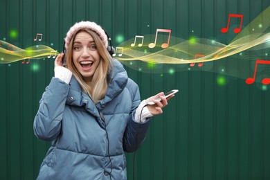Happy woman listening to music near green wall. Music notes illustrations flowing from headphones