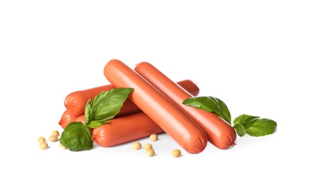 Photo of Raw vegetarian sausages with soybeans and basil on white background
