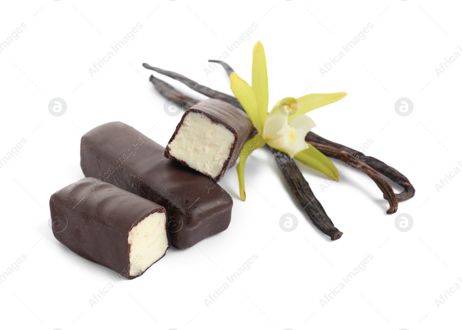 Photo of Glazed curd cheese bars, vanilla pods and flower isolated on white