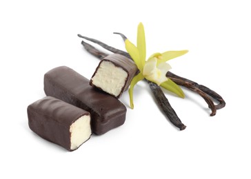 Photo of Glazed curd cheese bars, vanilla pods and flower isolated on white