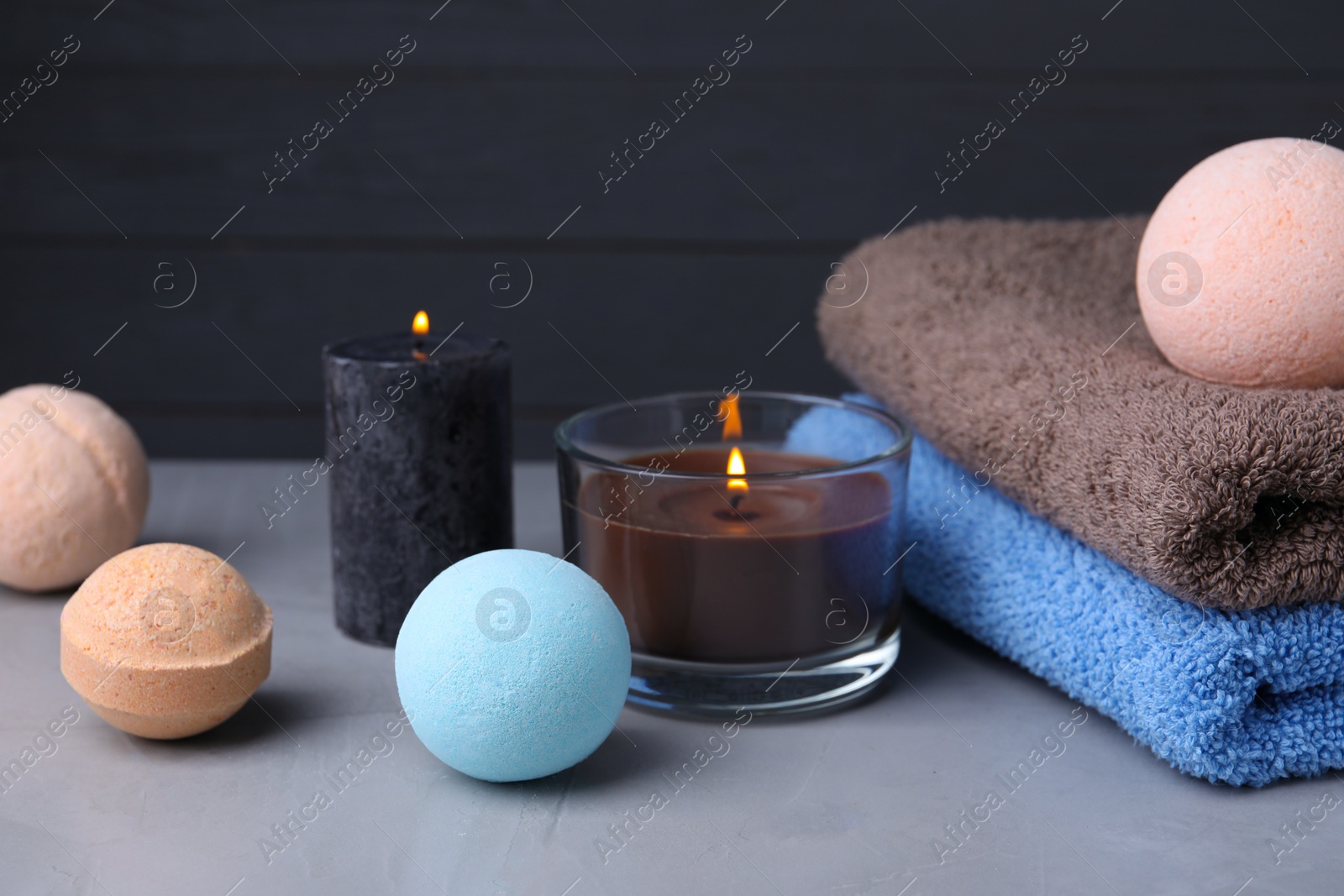 Photo of Beautiful composition with aromatic bath bombs on light grey table