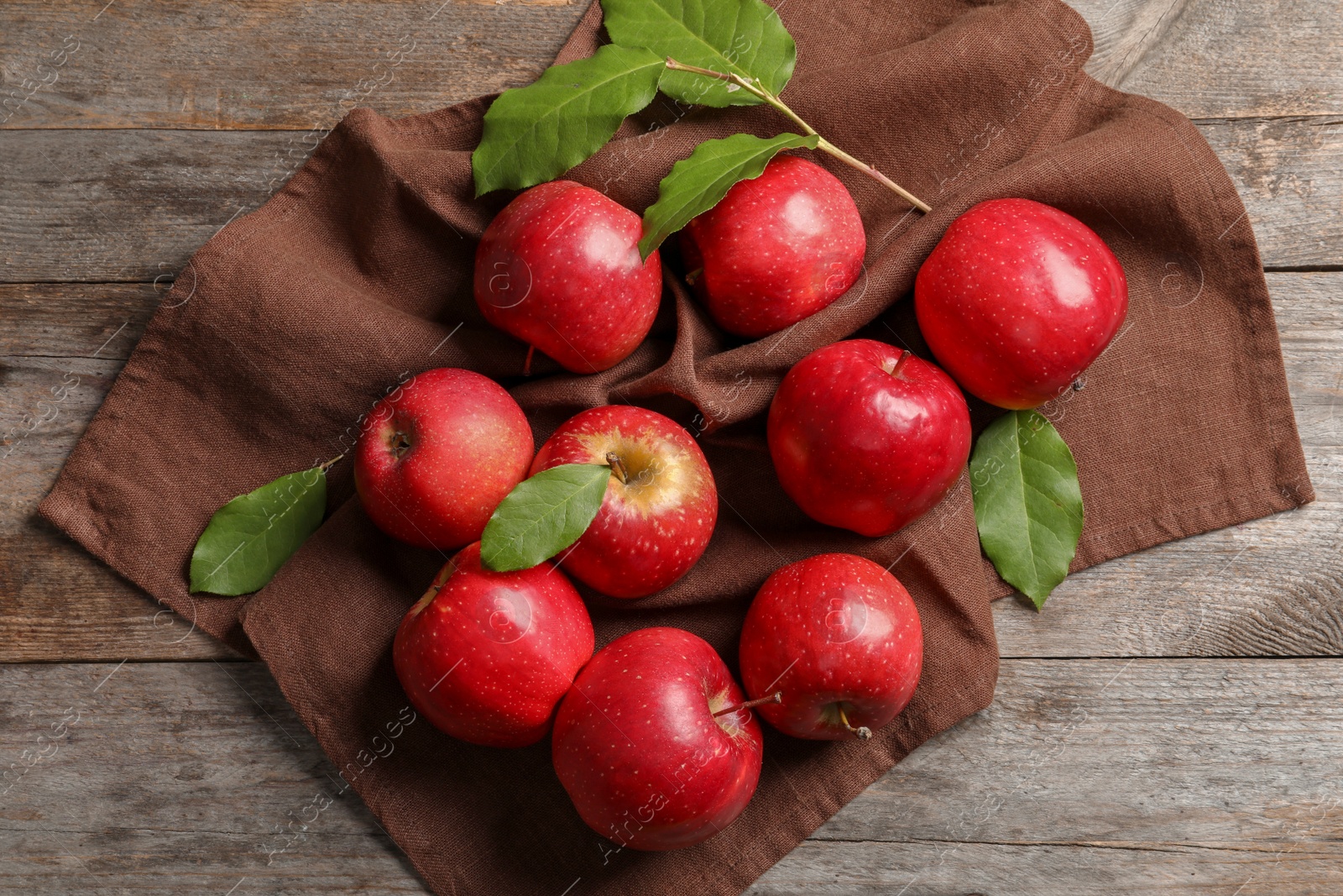 Photo of Fresh ripe red apples on wooden background