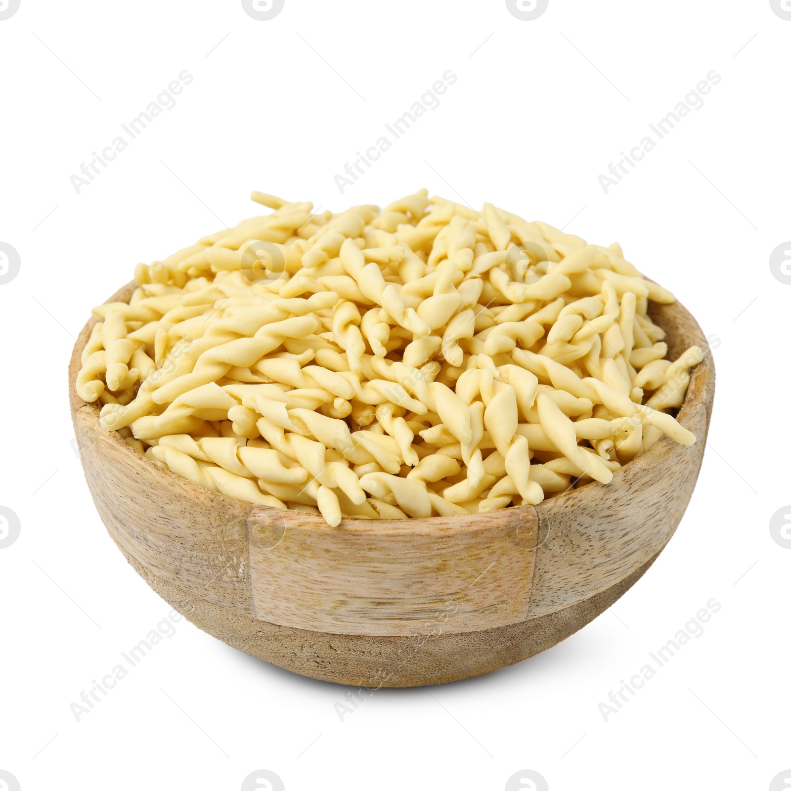 Photo of Uncooked trofie pasta in bowl isolated on white