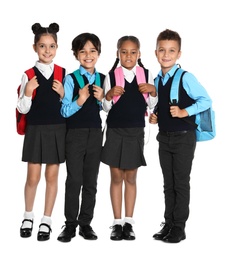 Photo of Happy children in school uniform on white background