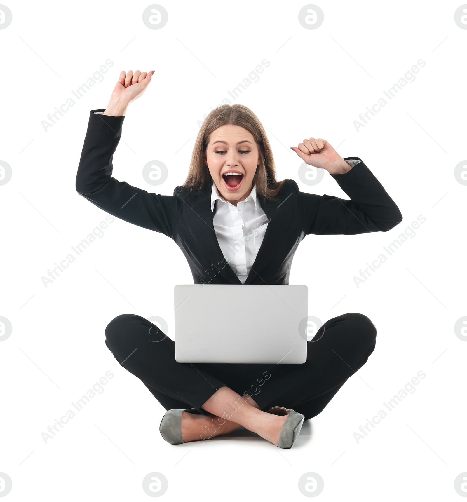 Photo of Emotional businesswoman in office wear with laptop celebrating victory on white background