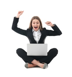 Emotional businesswoman in office wear with laptop celebrating victory on white background