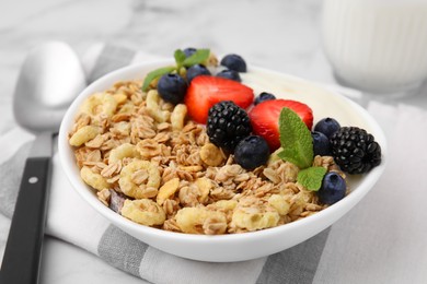 Photo of Tasty oatmeal, yogurt and fresh berries in bowl on table, closeup. Healthy breakfast