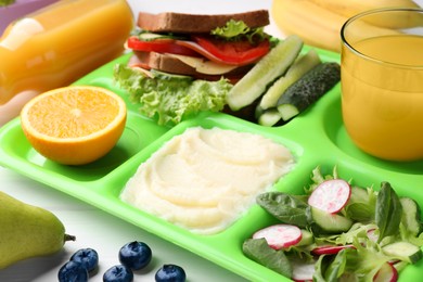 Serving tray of healthy food on table, closeup. School lunch