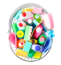 Shopping basket with different detergents on white background, top view