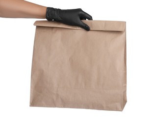 Woman holding paper bag on white background, closeup