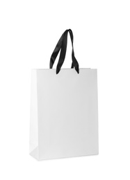 Photo of Paper shopping bag isolated on white. Mock up for design