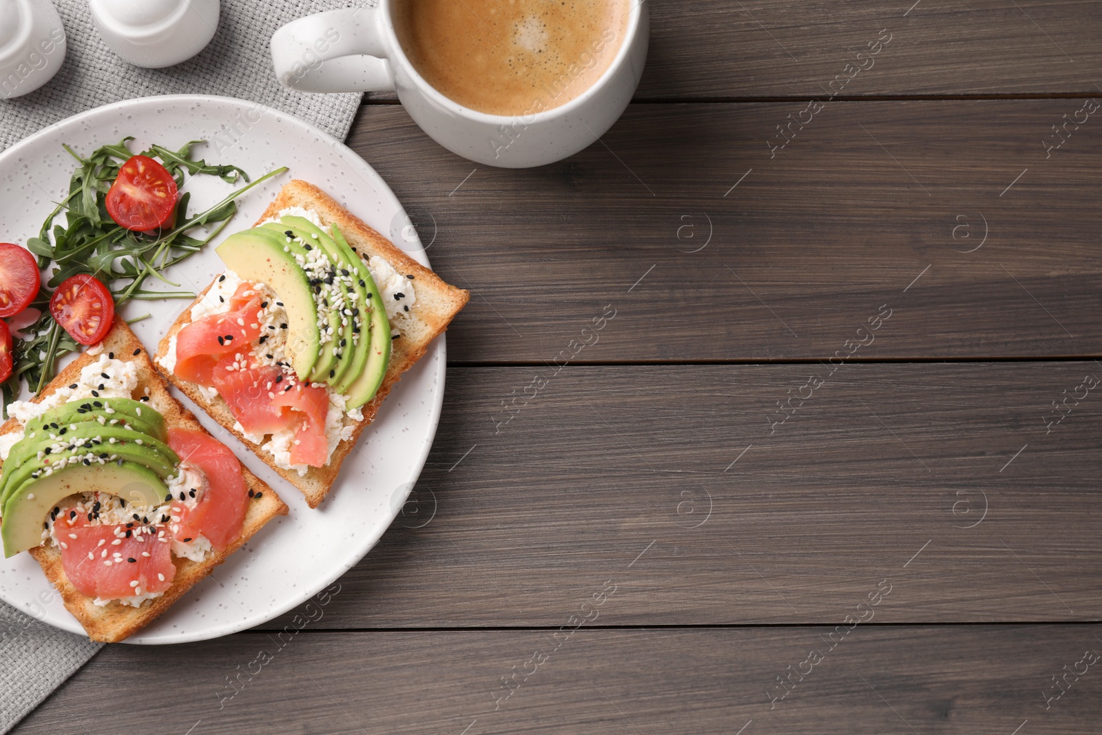 Photo of Delicious sandwiches and coffee on wooden table, flat lay. Space for text