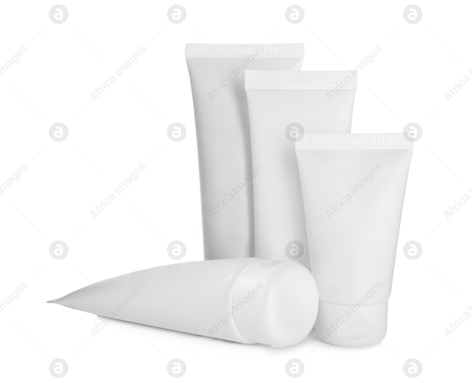 Photo of Blank tubes of cosmetic products on white background