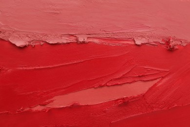 Photo of Texture of different lipsticks as background, closeup
