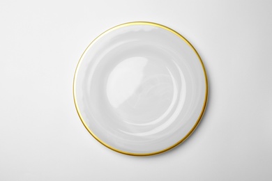 Photo of Clean empty plate on white background, top view