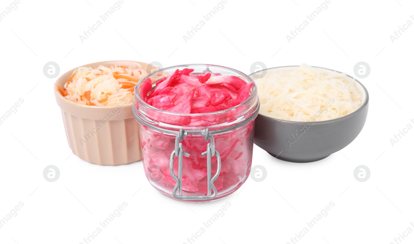 Photo of Delicious sauerkraut prepared according to different recipes on white background