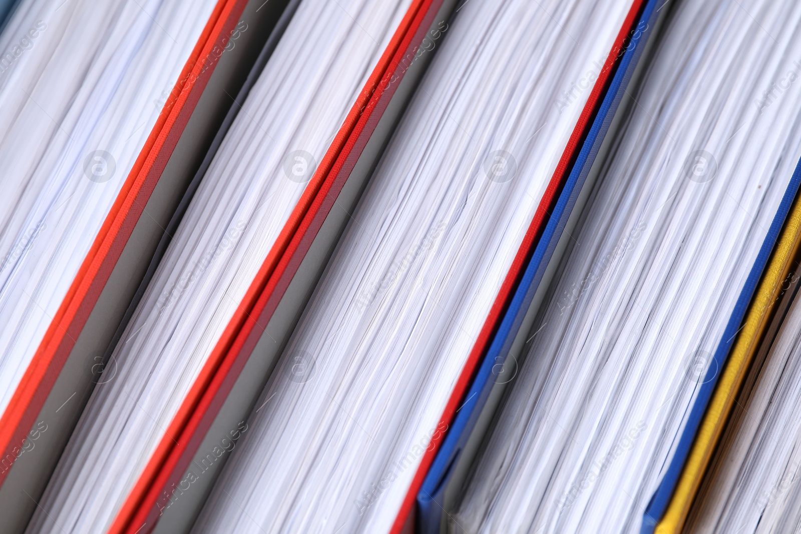 Photo of Colorful binder office folders as background, closeup