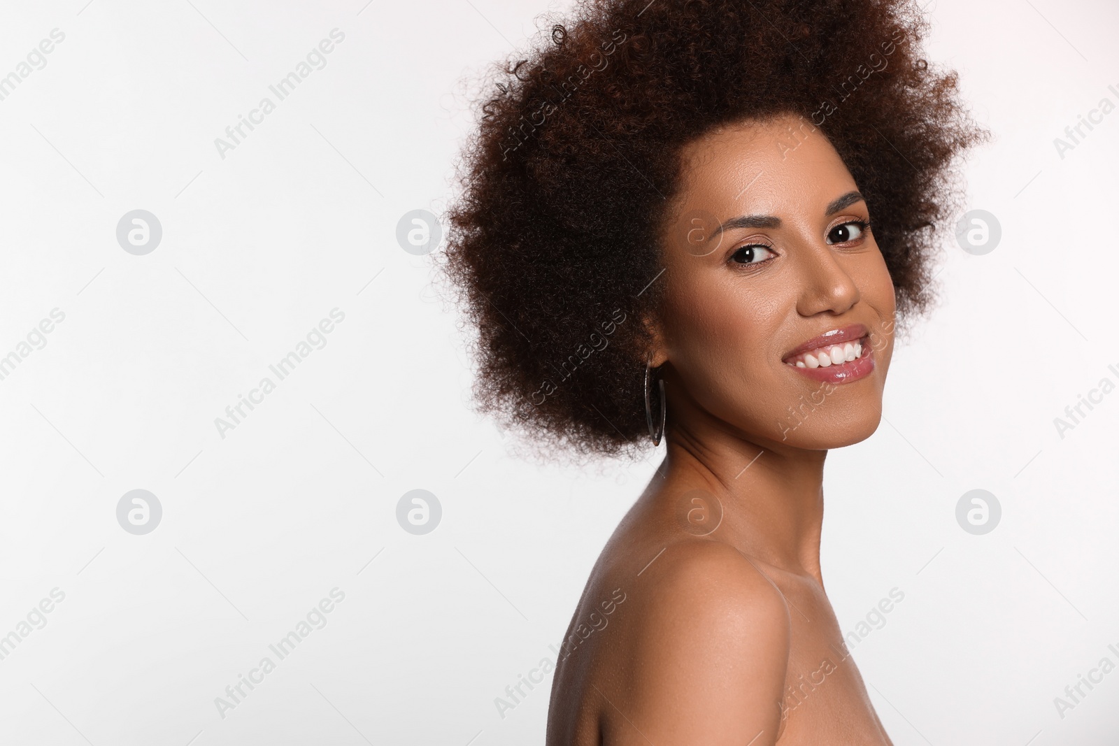 Photo of Portrait of beautiful young woman with glamorous makeup on white background. Space for text