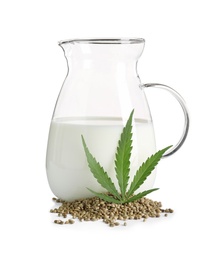 Glass jug with hemp milk on white background