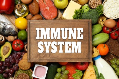 Image of Immune system boosting with proper nutrition. Different foods and board, flat lay