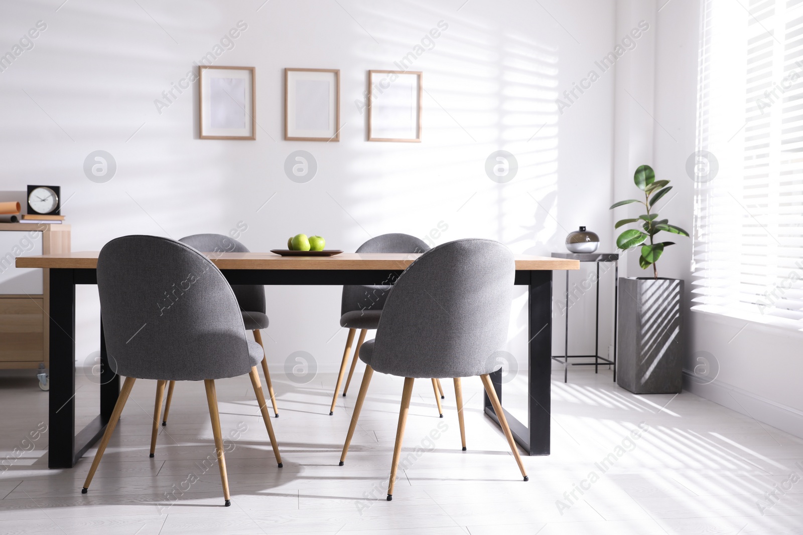 Photo of Stylish room interior with table and chairs. Idea for design