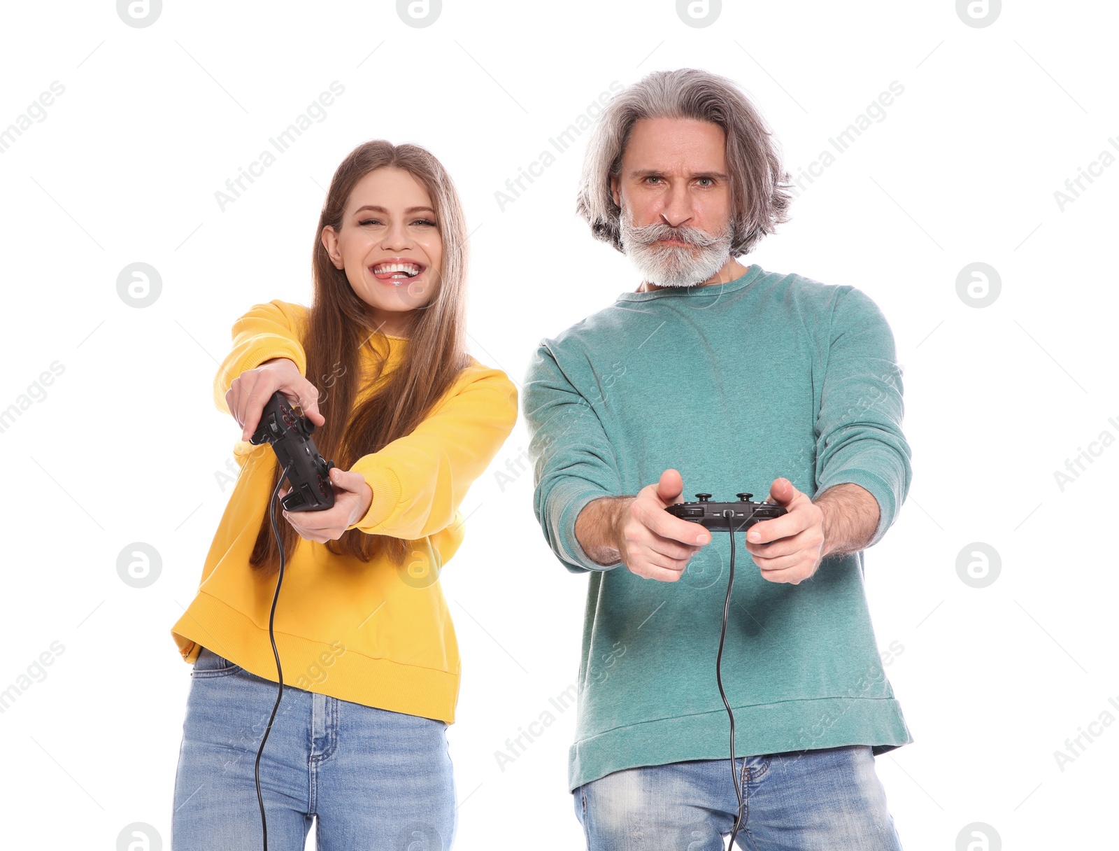 Photo of Mature man and young woman playing video games with controllers isolated on white