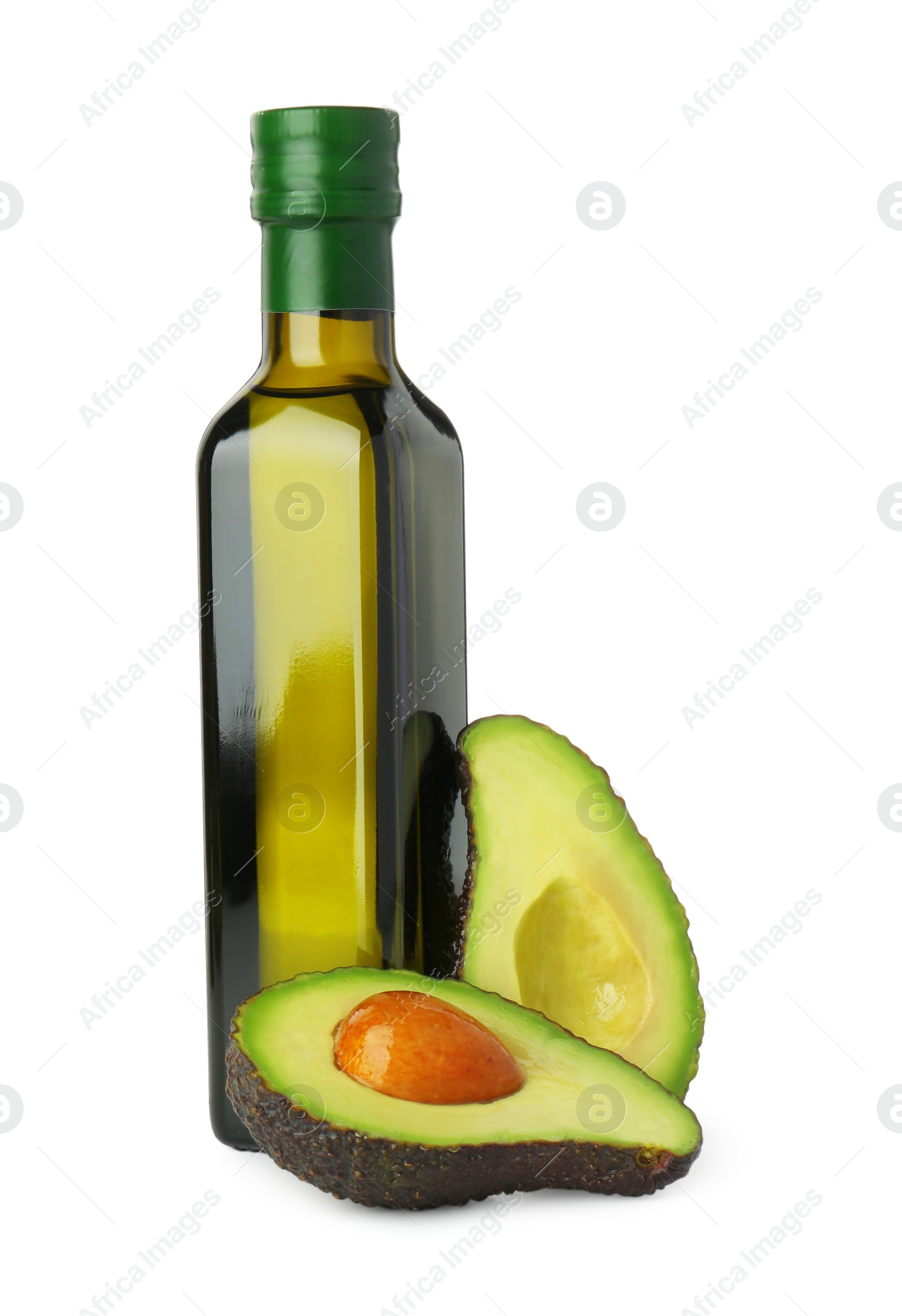 Photo of Vegetable fats. Bottle of cooking oil and fresh cut avocado isolated on white