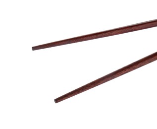 Photo of Pair of wooden chopsticks isolated on white