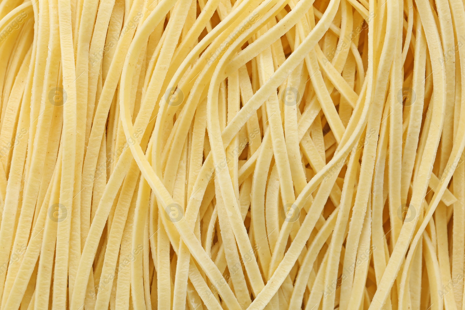 Photo of Quick cooking noodles as background, closeup view