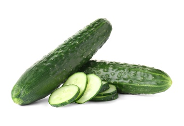 Photo of Whole and sliced fresh cucumbers on white background