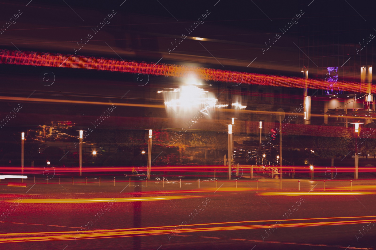 Photo of Road with light trails in city, motion blur effect. Night life