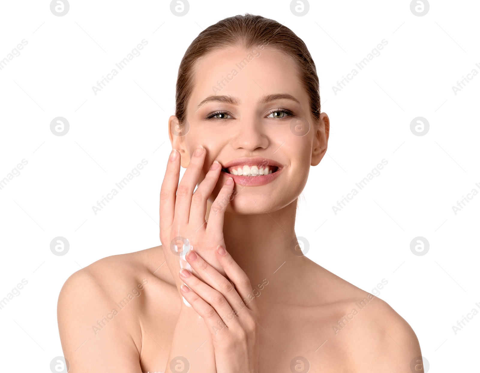 Photo of Young woman applying hand cream on white background