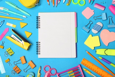 Flat lay composition with different school stationery on color background