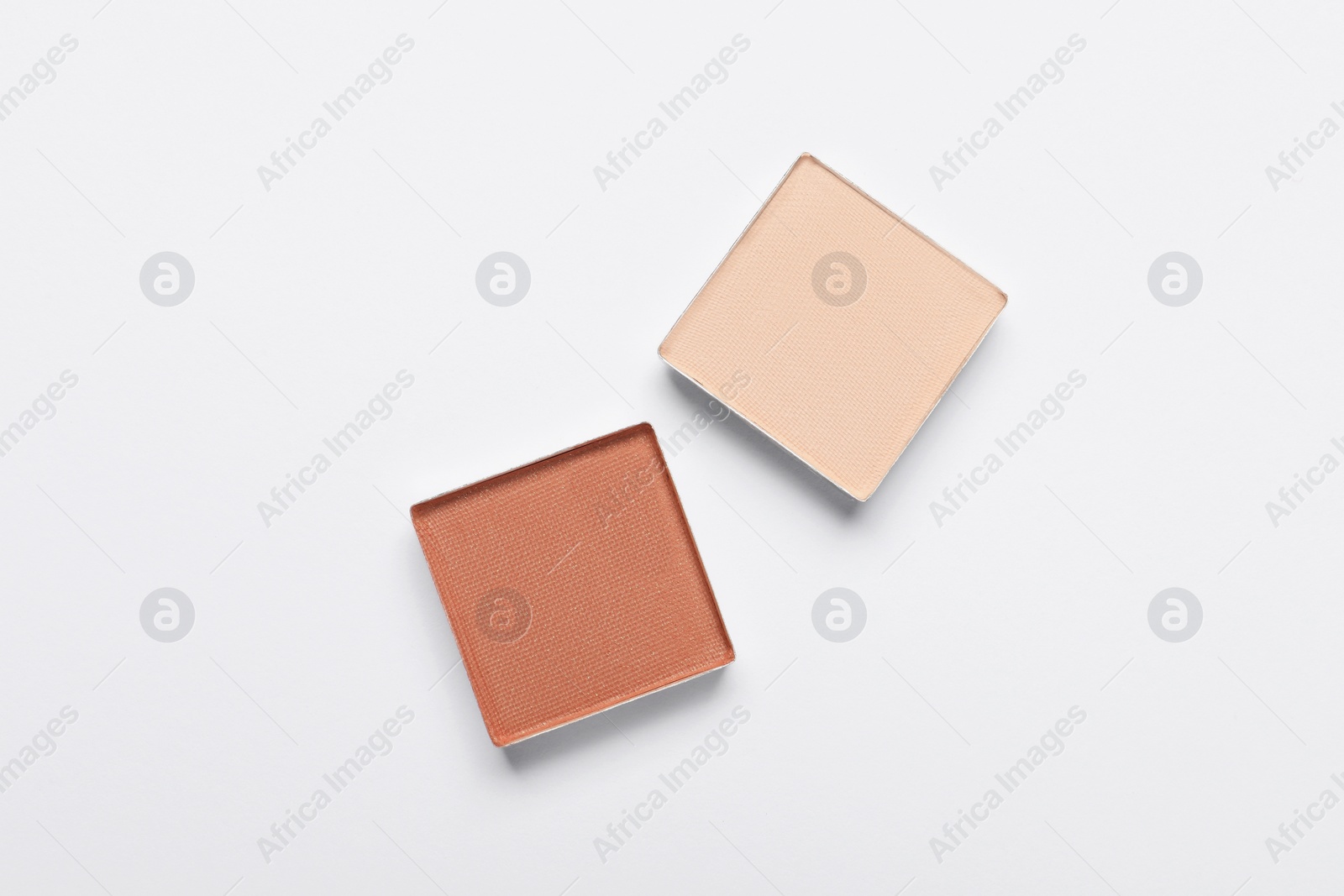 Photo of Beautiful eye shadow refill pans on white background, flat lay